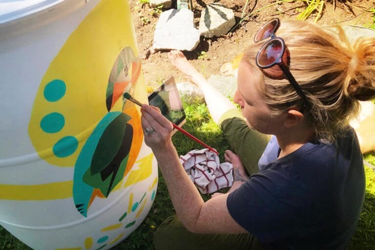 DIY rain barrel painted using leftover paint