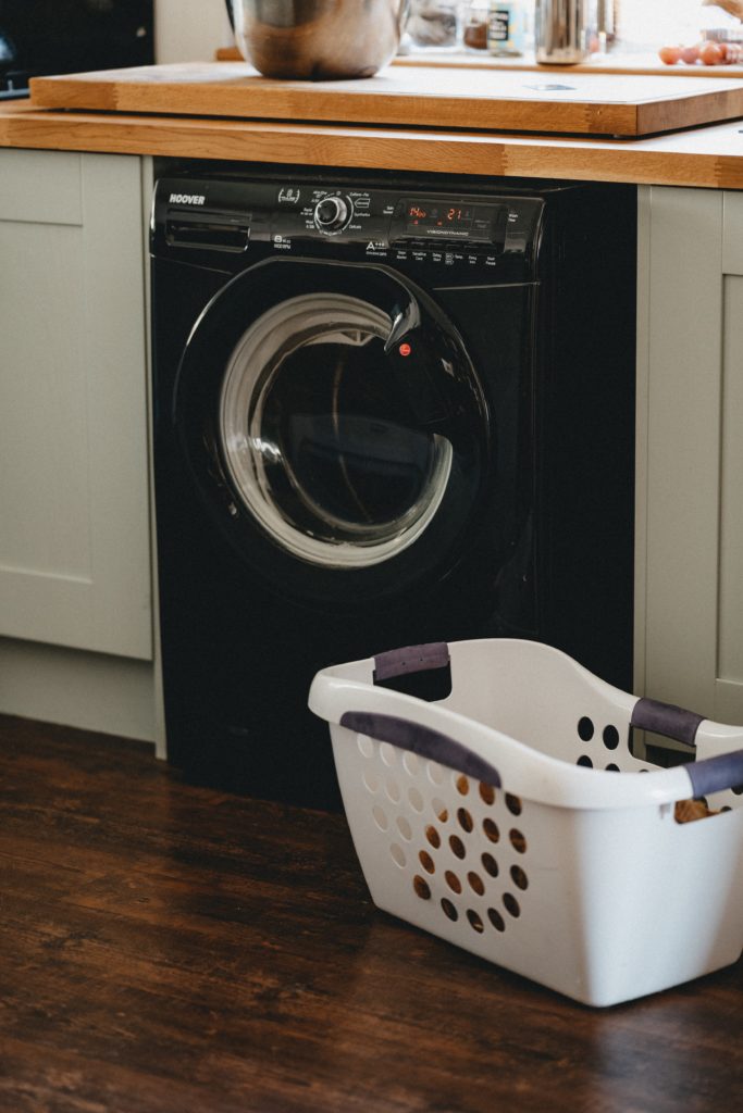 Washer machine with basket on side