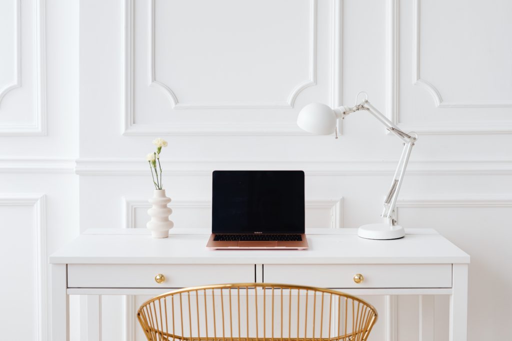 laptop on white desk