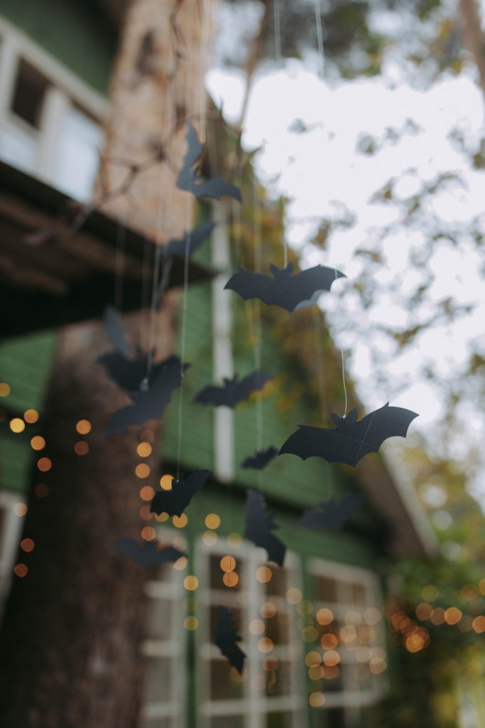 paper bats hanging from tree